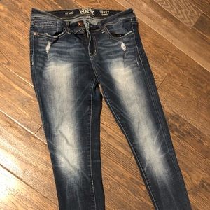 Buckle distressed skinny ankle jeans